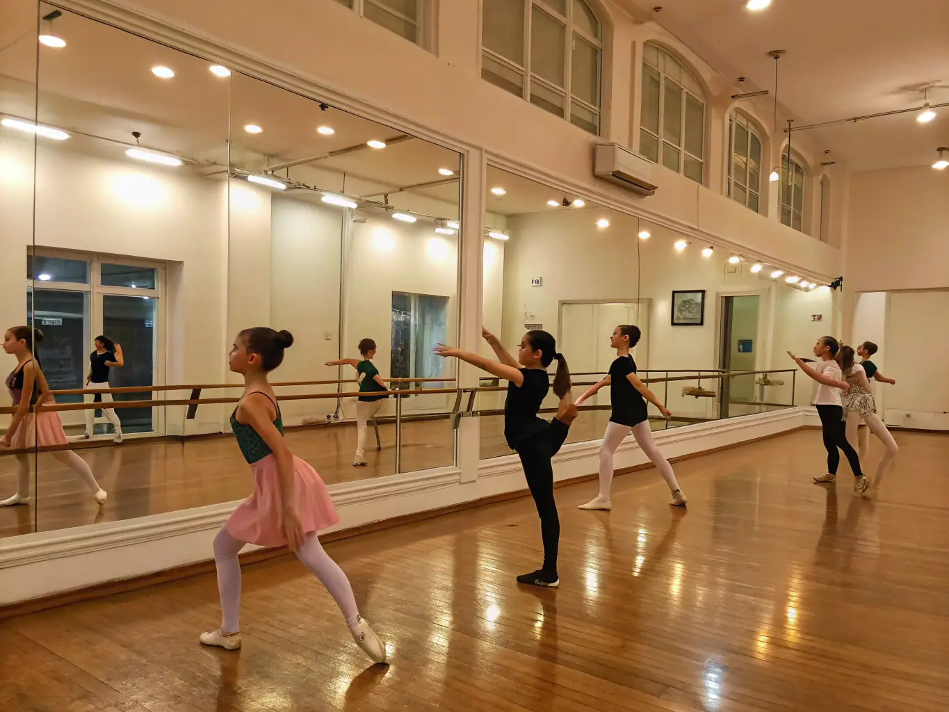 A group of ballet students in a graceful pose at RhythmFlow Studio, demonstrating elegance and precision, with the instructor providing corrections.